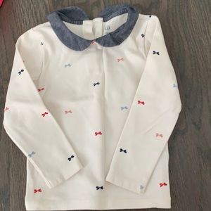 Adorable girls blouse with bow detail.